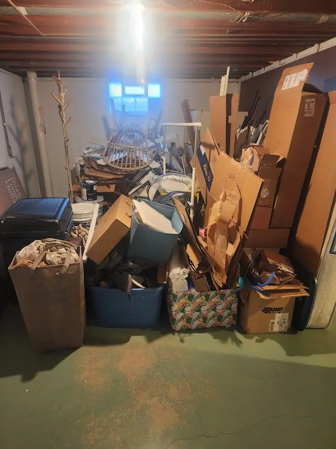 Roll-off dumpster container at job site for Yard Waste Dumpster Rental in Le Claire